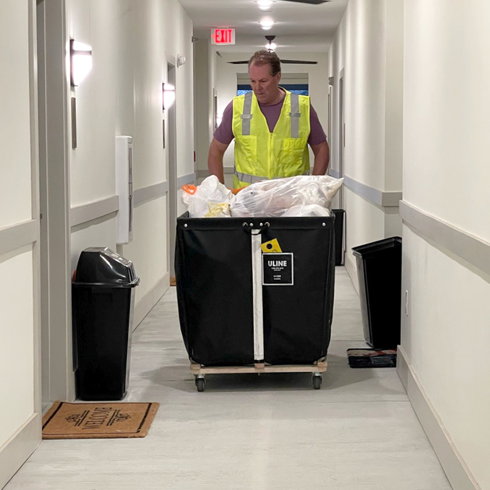 Uniformed attendant in hallway